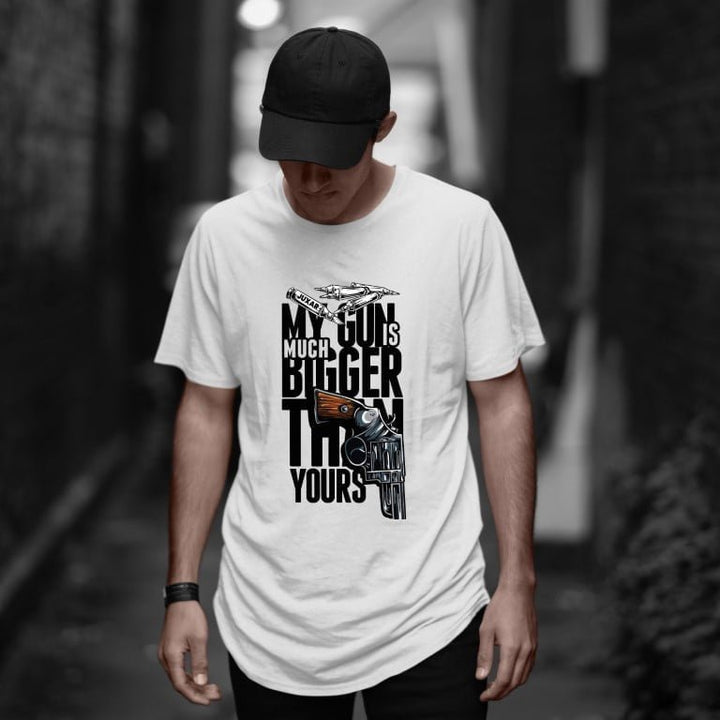 Juxar cotton longline tees white with big revolver print and bold typography funny gun graphic t-shirt on male model