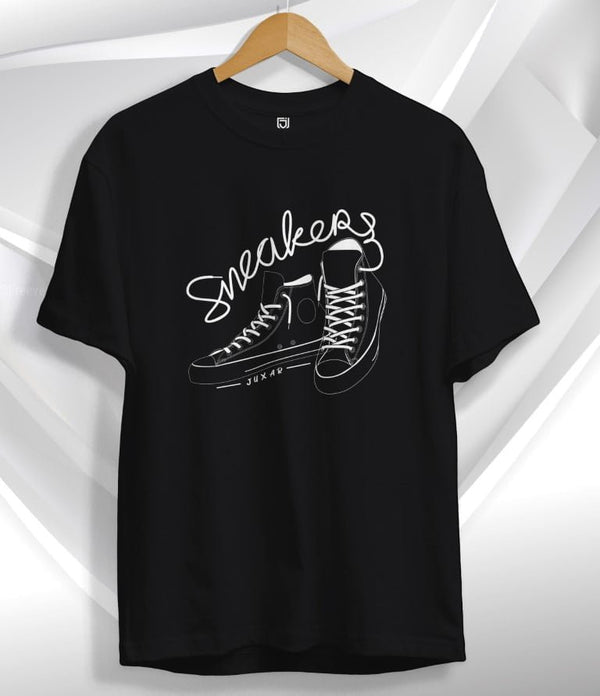 Juxar black sneaker graphic t-shirt featuring white outlined sneaker design and text on front