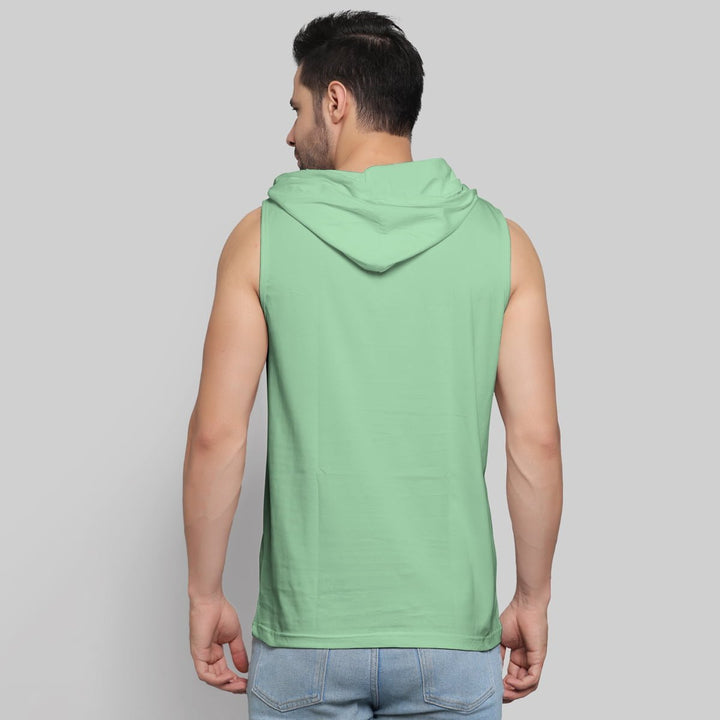 Back view of a man wearing Juxar sleeveless hoodie in mint green cute teddy bear hoodie style