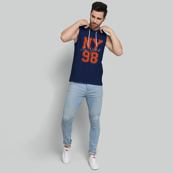 Juxar mens navy sleeveless raw edge hoodie with NY 98 print paired with light blue jeans and white sneakers