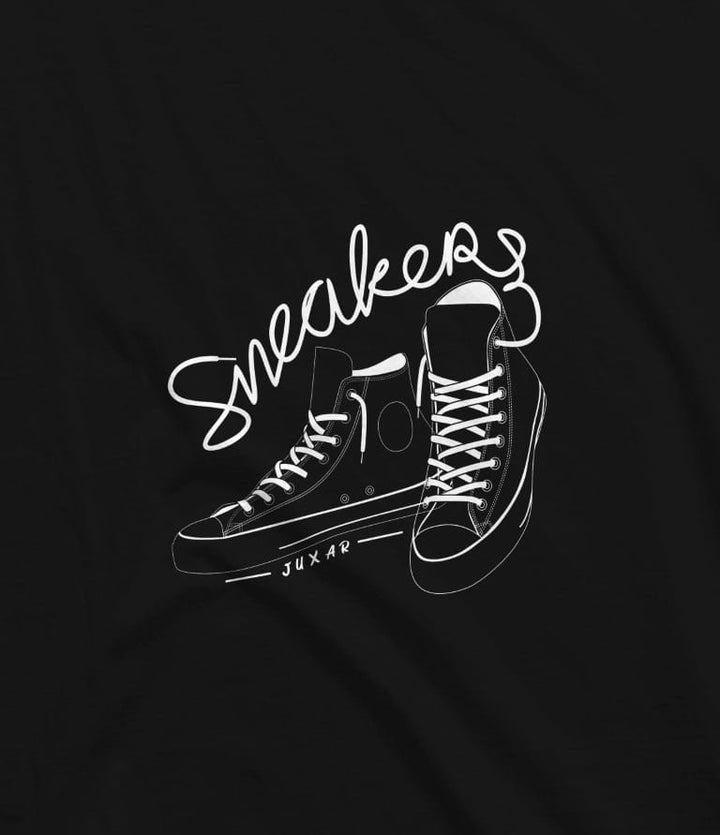 Juxar black sneaker graphic t-shirt featuring a white sketch of high-top sneakers with cursive sneakers text