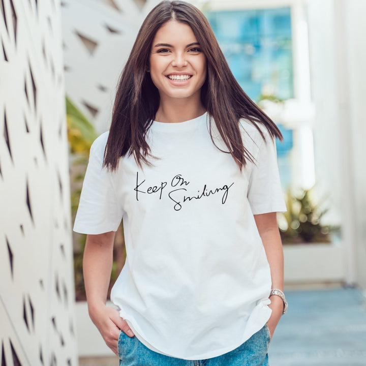 Juxar white graphic print boyfriend tee with Keep On Smiling script on casual relaxed fit