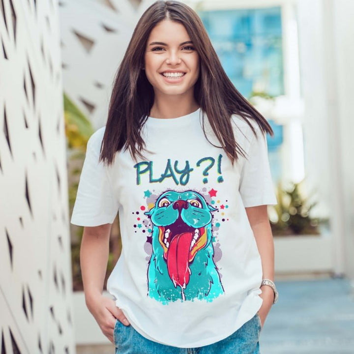 Juxar white boyfriend tee with rolled sleeves featuring colorful playful dog graphic and PLAY text worn by smiling woman