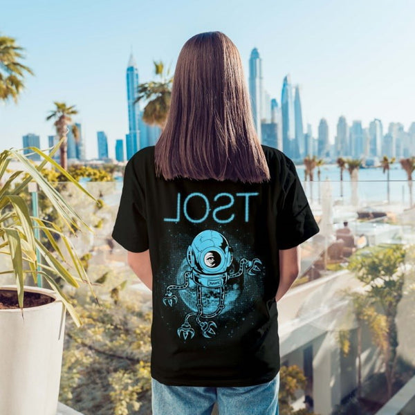 Black boyfriend t shirt with astronaut graphic on back on model at waterfront city skyline boyfriend t shirt outfit ideas