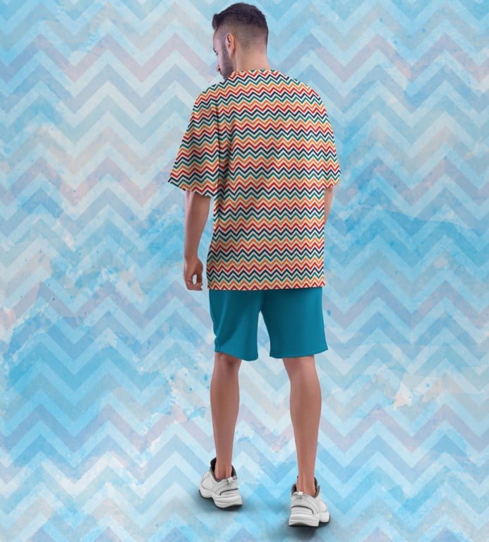 Juxar oversized printed t shirt with graphics multicolor zigzag print on male model back view with teal shorts