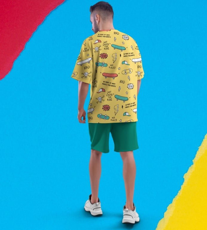 Juxar funky oversized printed t shirt yellow skate graphic on male model with green shorts