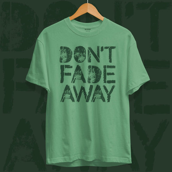 Juxar green cotton t shirt for gym workout with Dont Fade Away graphic print hanging on wooden hanger