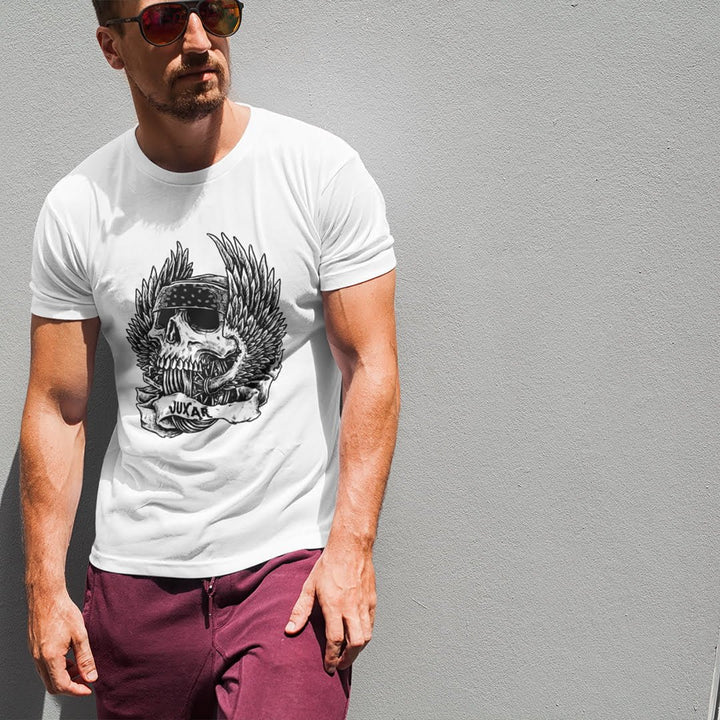 Juxar white cotton t shirt for travel with skull and wings graphic worn by man with sunglasses