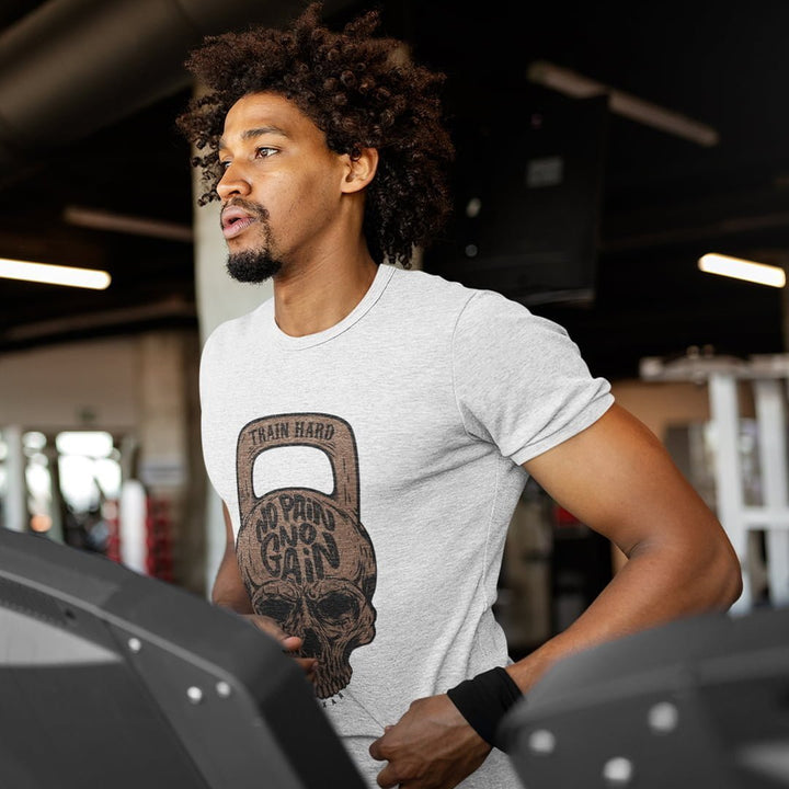 Juxar cotton t shirt with patchwork skull and kettlebell design worn by man running on treadmill