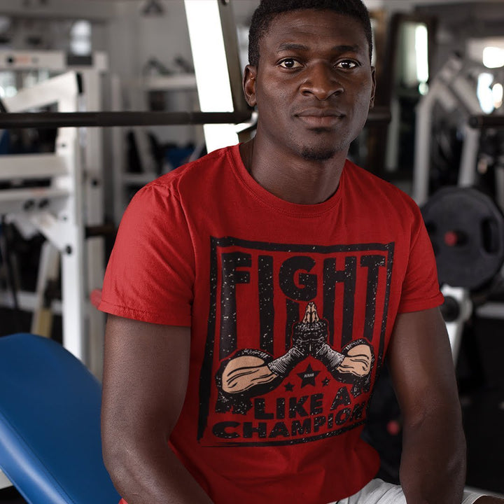 Juxar red double stitched cotton t shirt with Fight Like A Champion graphic worn by man in gym