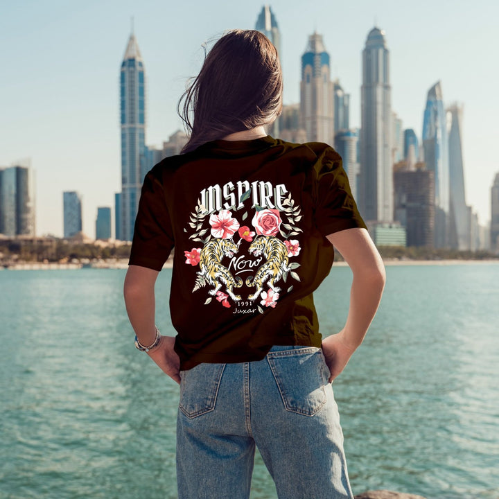Juxar streetwear boyfriend t shirt black with large floral Inspire back graphic worn by model against city skyline