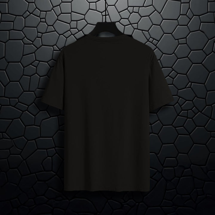 Juxar black business theme t-shirt plain back view hanging on black textured wall