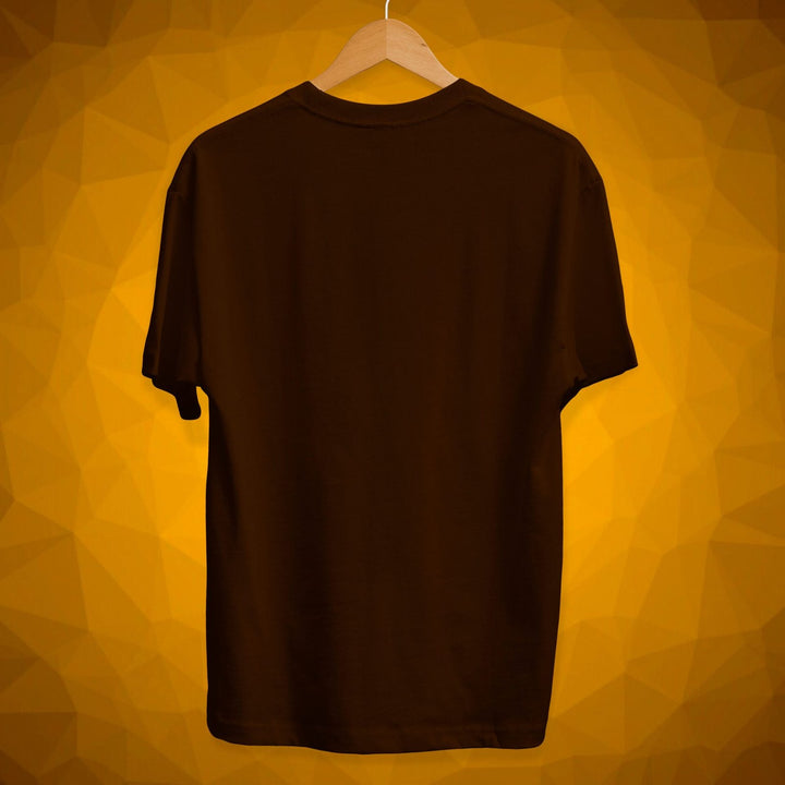 Juxar brown cotton graphic t shirt hanging on wooden hanger with yellow background
