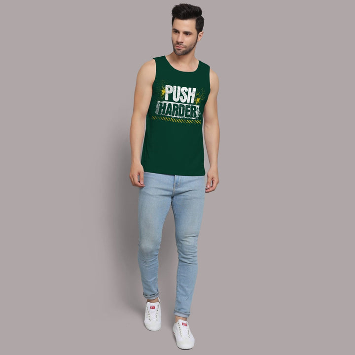 Juxar dark green fitness sando for men with push harder print, worn with light blue jeans and white sneakers