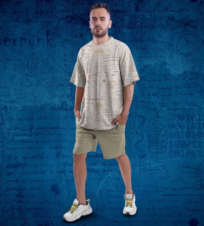 Juxar floral printed oversized t shirt beige with allover handwritten script print worn by male model with khaki shorts