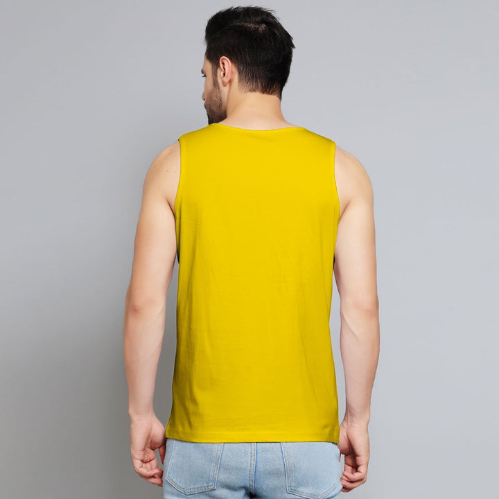 Back view of man wearing bright yellow funny sleeveless sando for men paired with light blue jeans