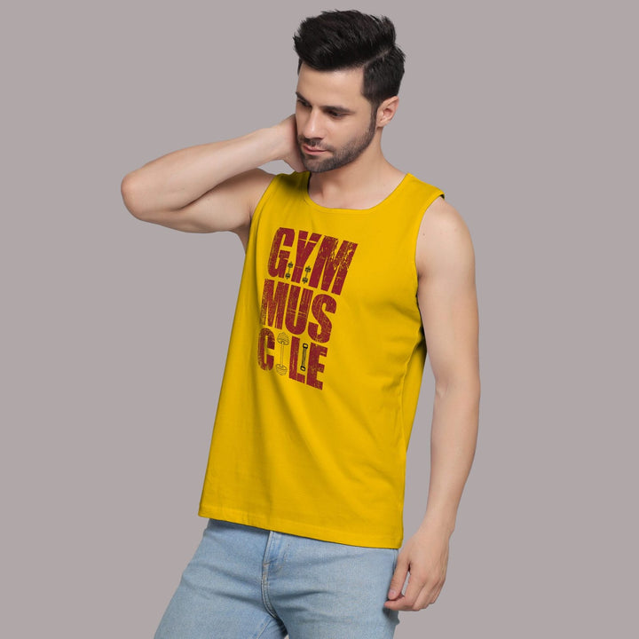 Juxar yellow gym sando for men with gym muscle text worn by male model with light blue jeans