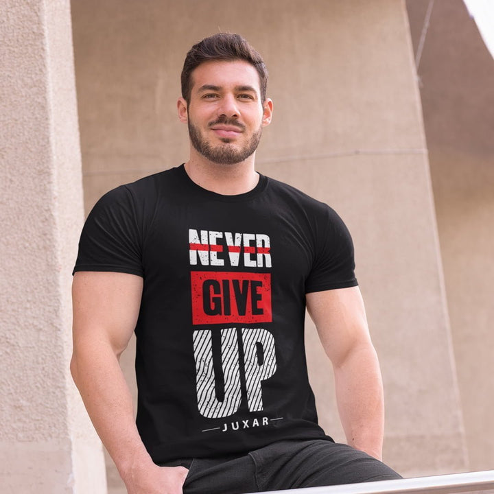 Juxar black inspirational quote t-shirt with Never Give Up design worn by man