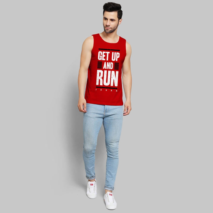 Juxar men's running tank in red with Get Up and Run graphic worn with light blue jeans and white sneakers