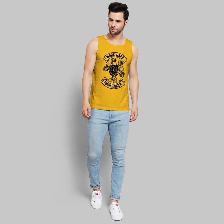 Juxar mens sleeveless gym wear yellow tank top with work hard print paired with light blue jeans