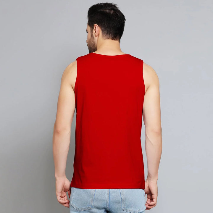 Juxar mens sleeveless lifting shirt in red worn by a man showing back view with light blue jeans