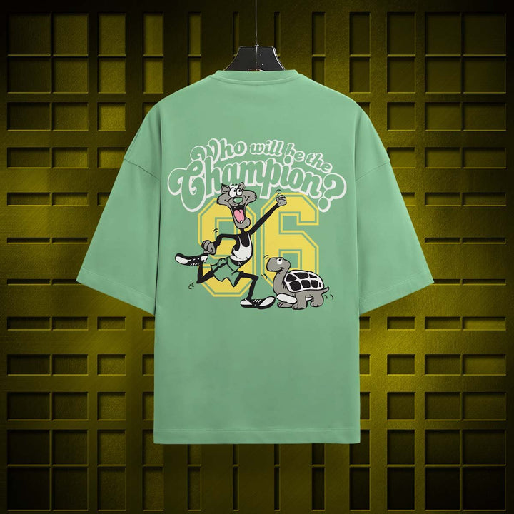 Juxar oversized cotton t-shirt with print featuring cartoon characters and text on green fabric