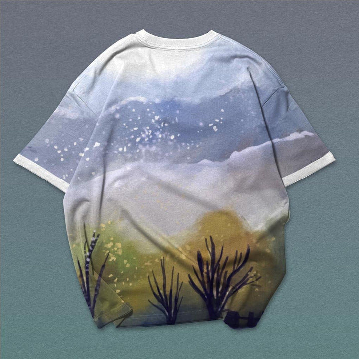 Mens oversized graphic tee with pastel mountain and cloud landscape print on back