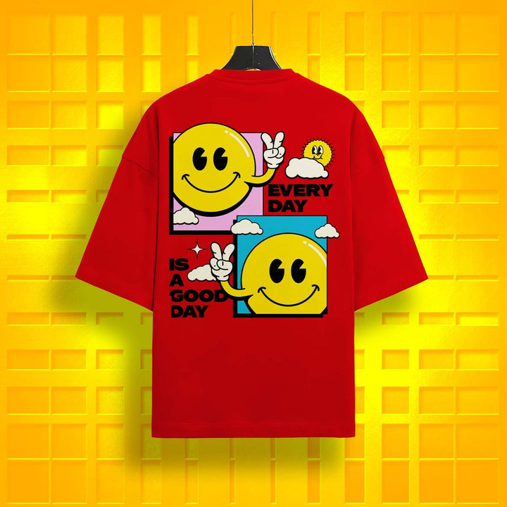 Juxar plain cotton oversized t-shirt in red with smiling face graphic and positive text on back