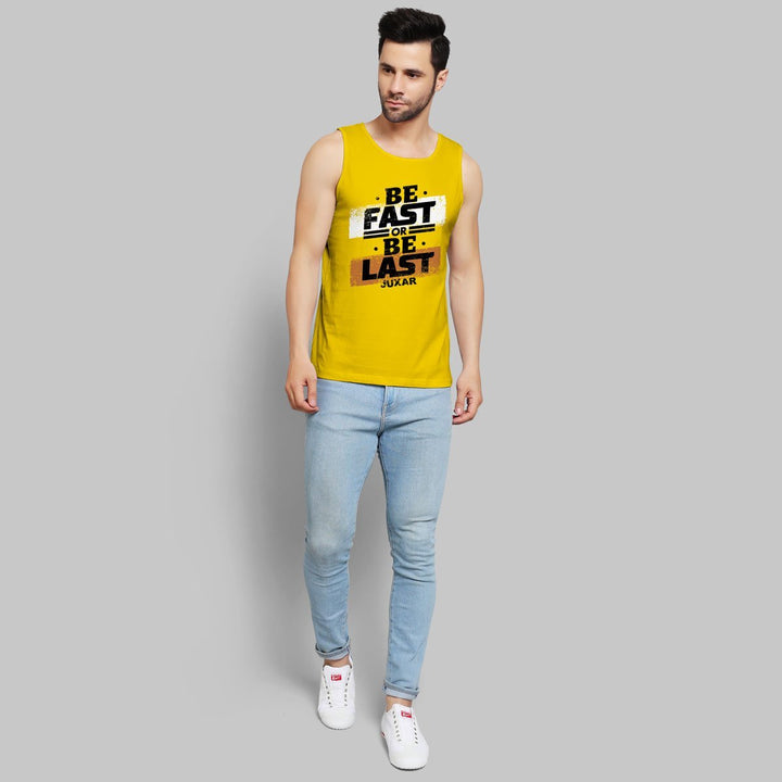 Juxar printed sando for men in yellow with motivational text paired with light blue jeans and white sneakers