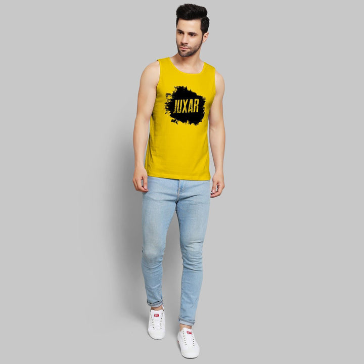 Juxar yellow sleeveless top sportswear for men paired with light blue jeans and white sneakers