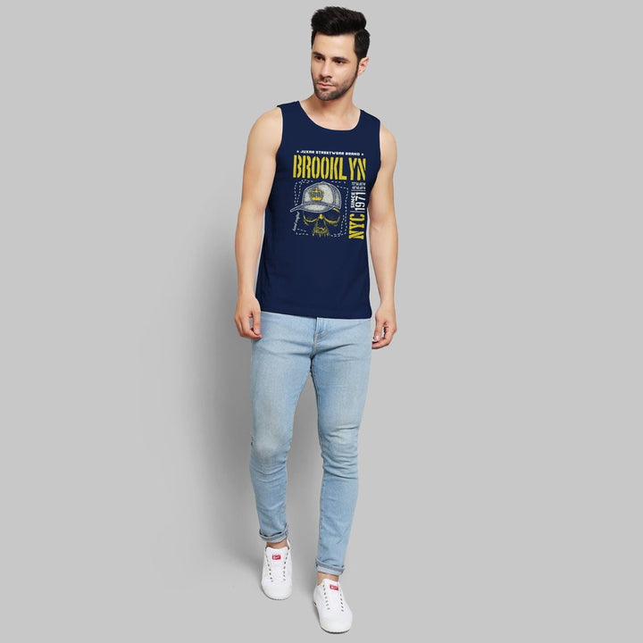 Juxar mens navy blue stretchable sando with Brooklyn graphic paired with light blue jeans and white sneakers