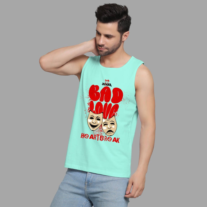 Juxar theater mask print muscle tee in light blue worn by man with casual pose