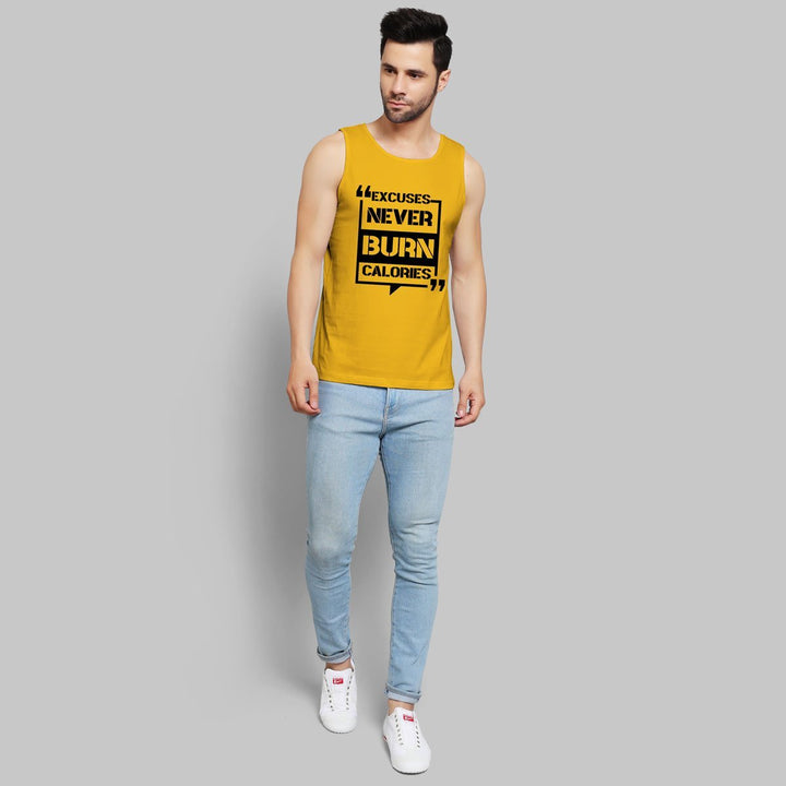 Juxar mens yellow gym sando with motivational text paired with light blue jeans and white sneakers