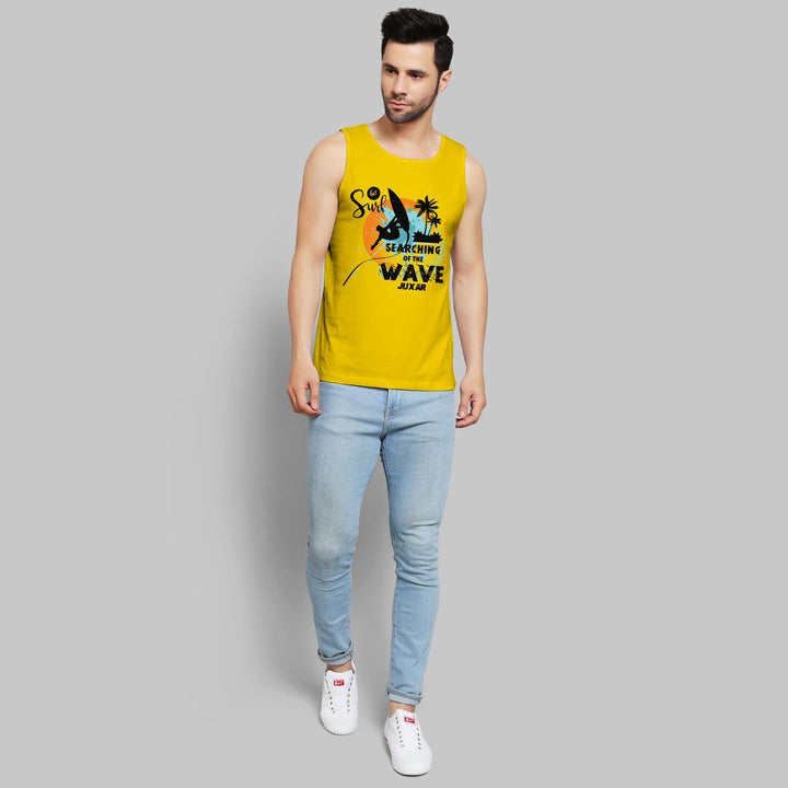 Juxar yellow surf sando for beachwear with wave and palm tree graphic worn by male model