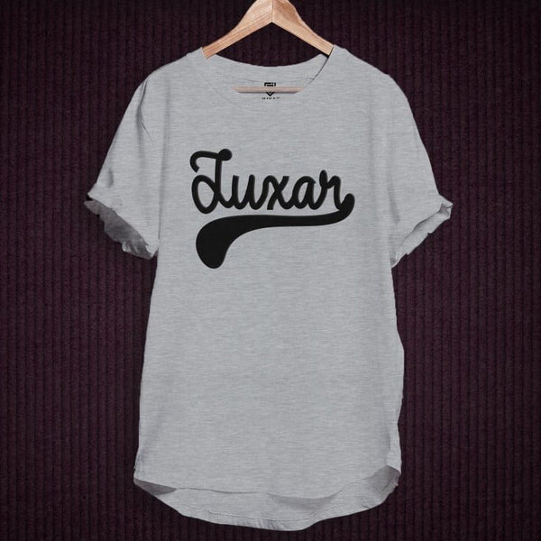 Juxar gray cotton longline t shirt with black script logo on hanger showing curved hem and rolled sleeves