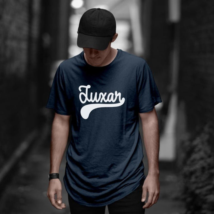 Juxar navy longline tee on male model wearing cap in alleyway showcasing luxury cotton longline t shirt