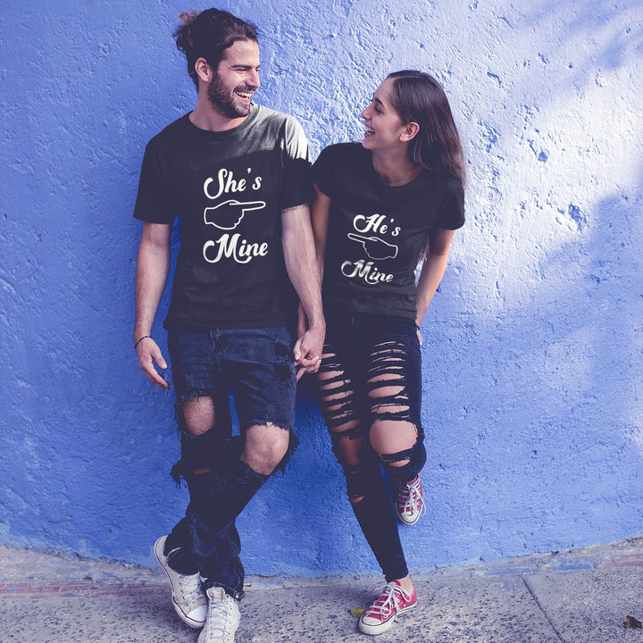 Juxar long distance couple t shirt set black matching tees Shes Mine Hes Mine holding hands against blue wall