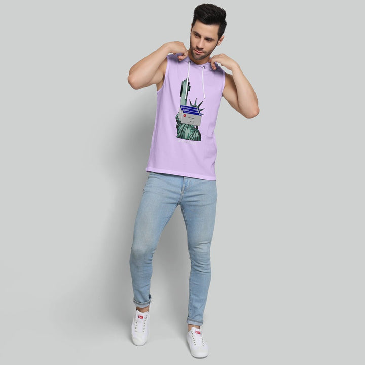Man wearing Juxar sleeveless lavender hoodie with Statue of Liberty print and light blue jeans in men's gym wear