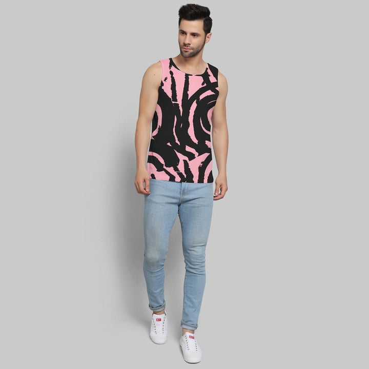 Juxar men sleeveless t-shirt with black and pink abstract pattern worn with light blue jeans and white sneakers