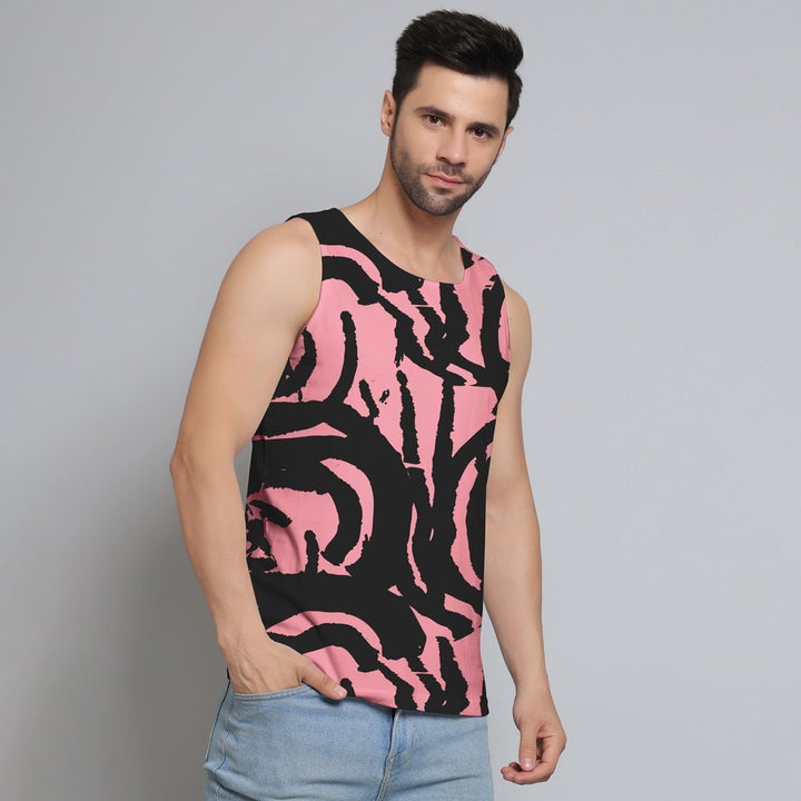 Juxar men sleeveless t-shirt with pink and black abstract design worn by a man with light blue jeans