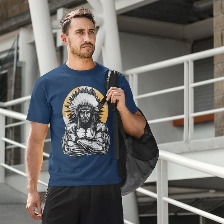 Man wearing navy muscleman chief t-shirt by Juxar featuring graphic of muscular Native American chief