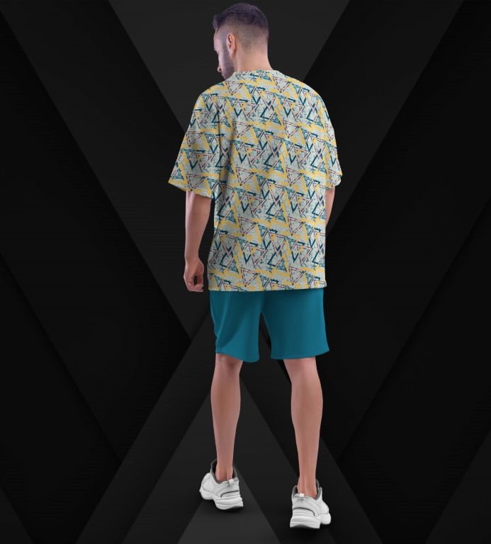 Juxar aesthetic oversized printed t shirt yellow geometric print back view on male model wearing teal shorts and white sneakers