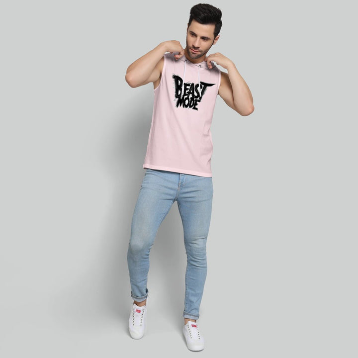 Mens pastel beast hoodie sando in pink with beast mode graphic worn with light blue jeans and white sneakers