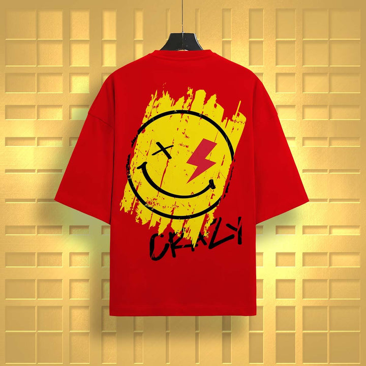 Red oversized t-shirt by Juxar with a yellow smiley face and lightning bolt graphic on the back