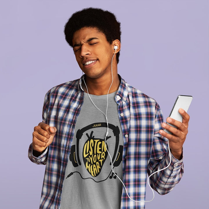 Young man wearing Juxar premium cotton t shirt with Listen to Your Heart design and plaid shirt