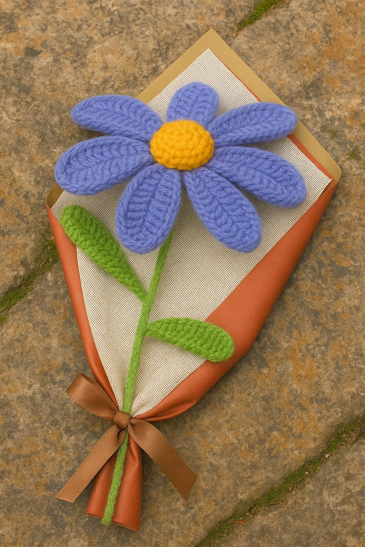 Purple lily wool flower gift crochet with green stem and leaves wrapped in brown paper tied with ribbon