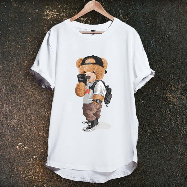 Juxar white longline tee with teddy bear wearing cap backpack and sneakers graphic on hanger casual cotton longline tee