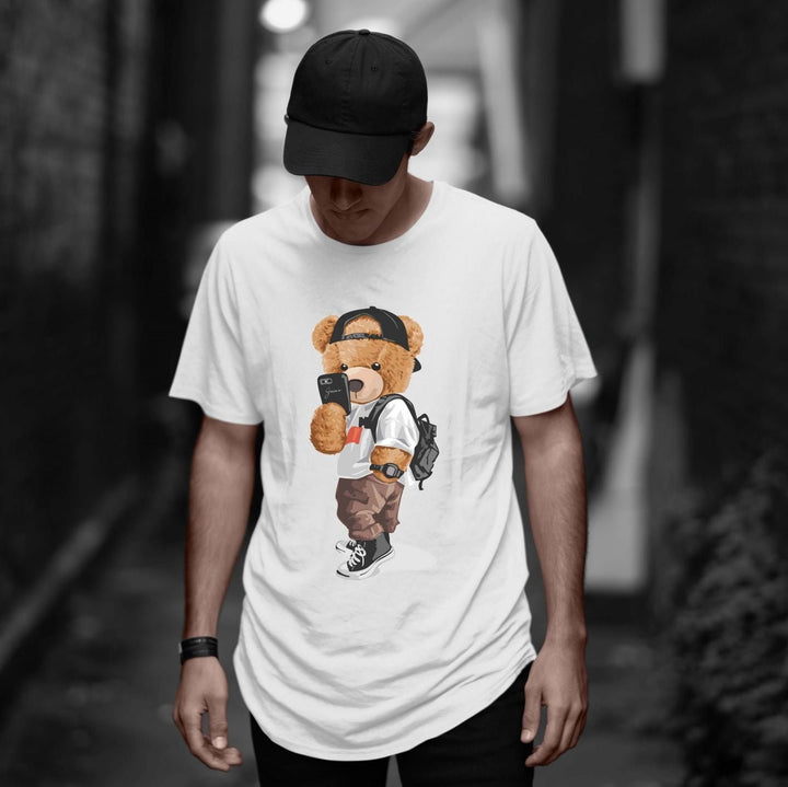 Juxar white casual cotton longline tee with teddy bear graphic worn by man with cap and backpack