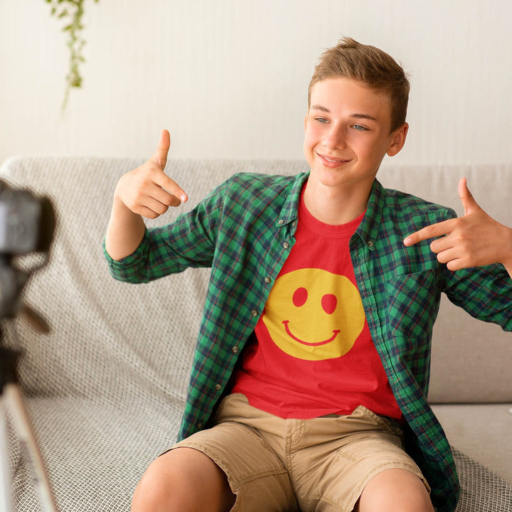 Juxar boys tie dye t shirt worn by teen boy wearing red smiley tee under green plaid shirt casual home video