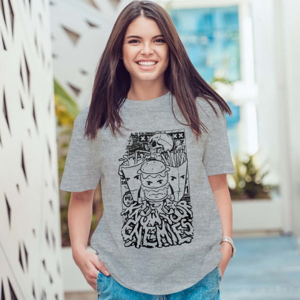 Juxar gray graphic boyfriend t shirt on smiling woman featuring black burger skull and fries street art design